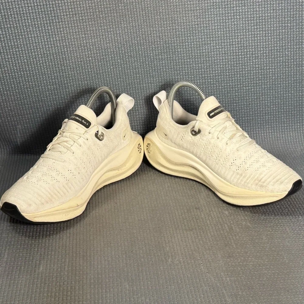 Nike Women's White Cream Running Shoes with Black Swoosh